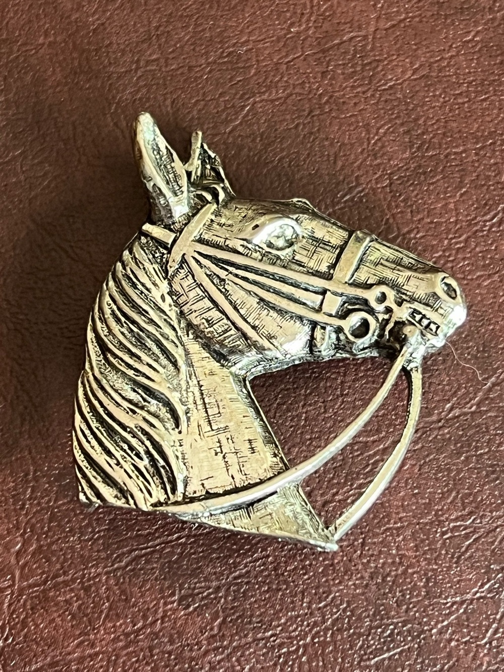 Silver horse head with bridle pin brooch